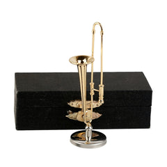 Dselvgvu miniature trombone with stand and case for display and collection.