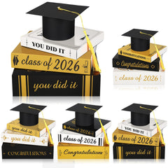 Dunzoom Class of 2026 cap and books ensemble decor brightens tabletops for a festive graduation setup