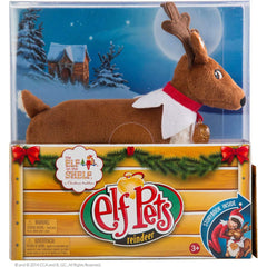 The Elf on the Shelf Pets Reindeer Tradition plush side view with book.