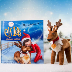 The Elf on the Shelf golden heart charm adds sparkle to the reindeer.