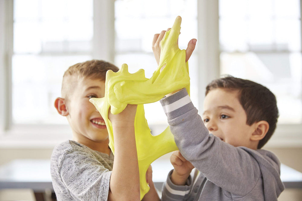 Kids crafting with Elmer's glue in a classroom setting