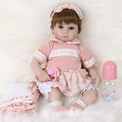 ENADOLL Reborn doll with big brown eyes inspiring nurturing play and comfort.