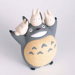 Ensky Totoro flower accessories add decorative flair to shelves.