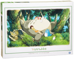 Ensky Totoro sleeping on a tree puzzle cover, licensed artwork for a cozy family activity.