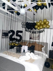 Enyeopd 40-inch silver number balloon pops against dark décor at any party