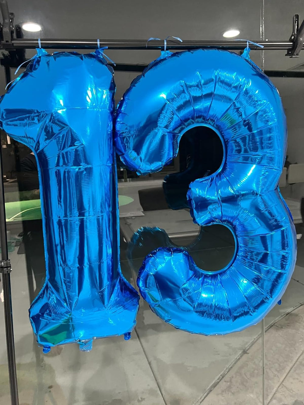 Enyeopd hanging number balloons for quick, dramatic decor.