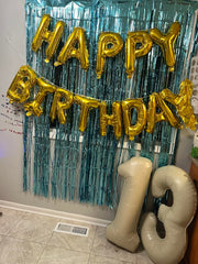 Enyeopd cream number balloons stacked creatively for dramatic displays.