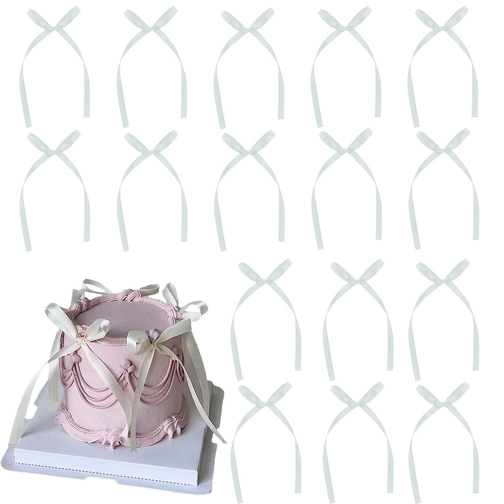 Etwgbaby white bow cupcake toppers for elegant desserts, perfect for weddings and baby showers.