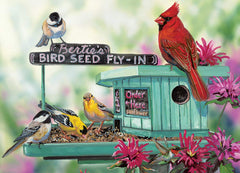 EuroGraphics Bertie's Bird Seed Fly-In puzzle pieces demonstrate durable interlock on blue board
