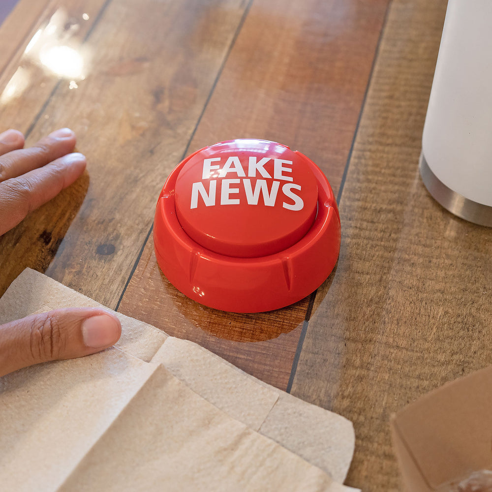 Fairly Odd Novelties Trumped Up Fake News Button side view emphasized red design for gifting