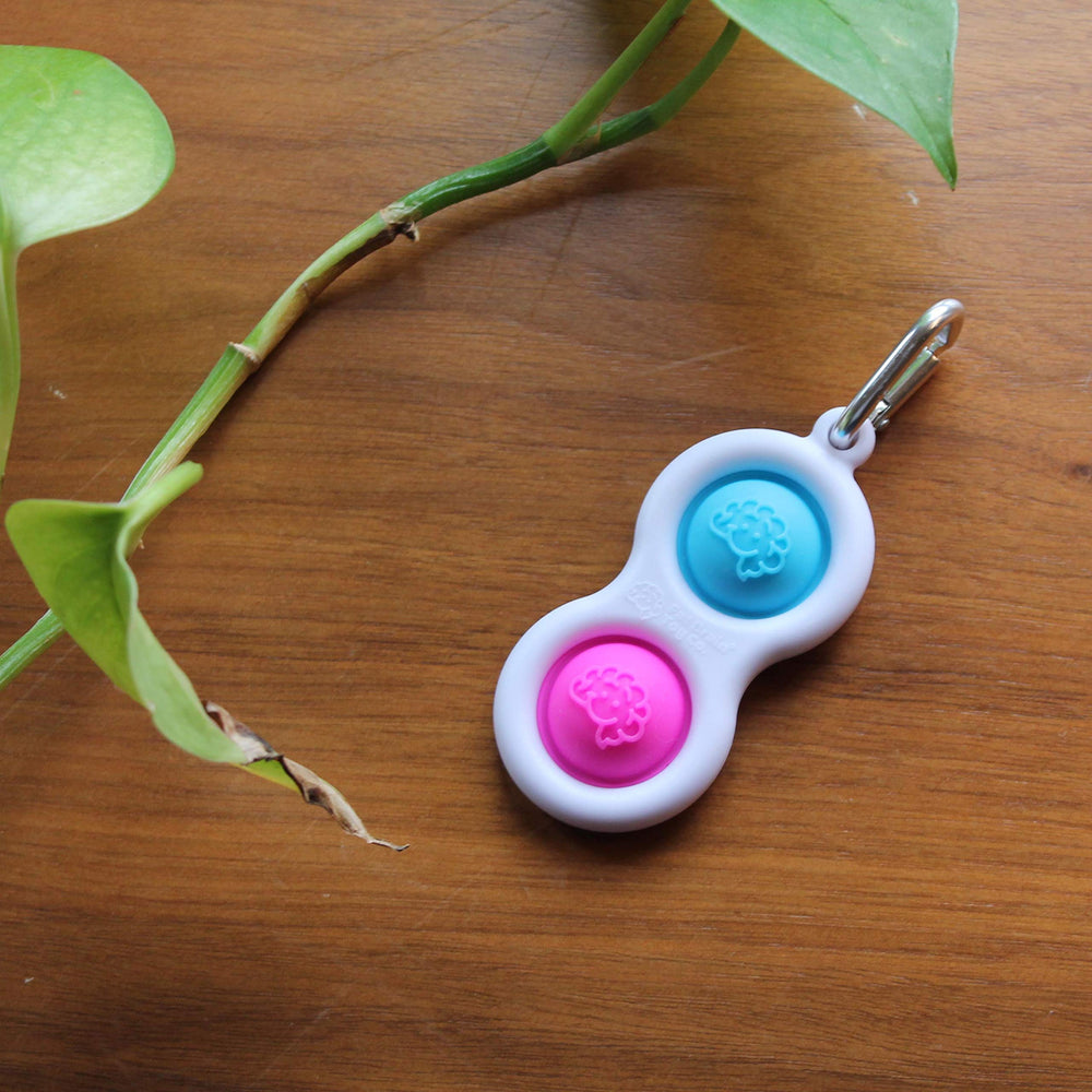 Fat Brain Toys Simpl Dimpl portable design shows on-the-go calm during travel.