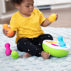 Fat Brain SpinnyPins textured pins encourage stacking and fine motor practice.