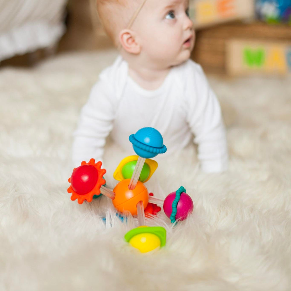 Compact Wimzle fits small hands for grab-and-go play.