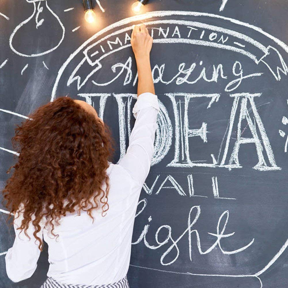 Feela complete sidewalk chalk set on driveway ideal for blackboard-style art.