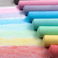 Feela sidewalk chalk in use on a sidewalk inspiring kid-friendly drawing outdoors.