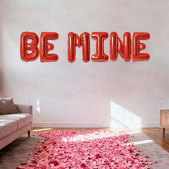 Fezava BE MINE 16in red letter balloons as centerpieces for fun, festive celebration tables.