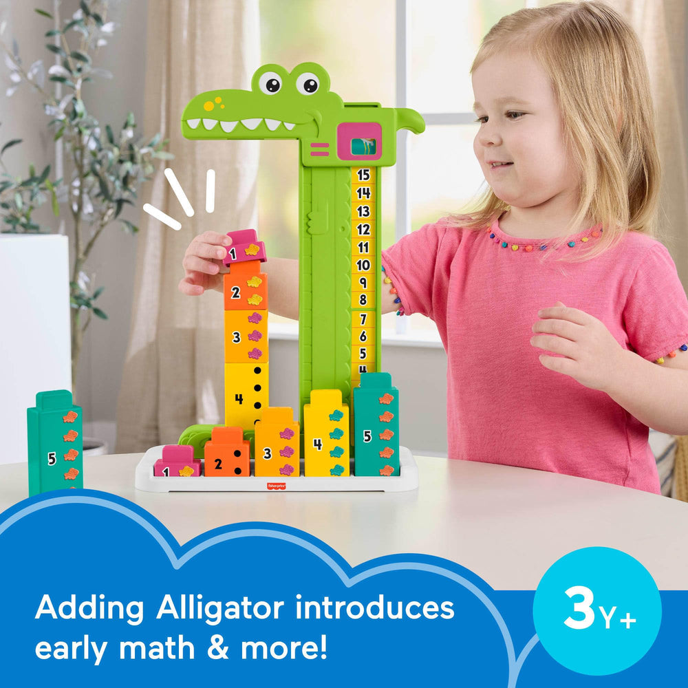 Fisher-Price alligator head slide reveals the sum to reinforce basic addition.