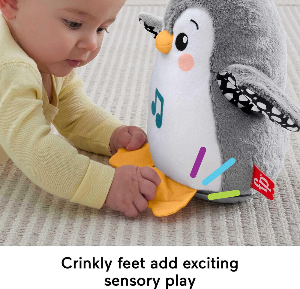 Soft plush, satin, and crinkle textures on Fisher-Price penguin for tactile exploration.