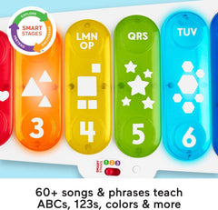 Toddler seated with the xylophone exploring sounds and colors during play.