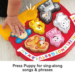 Puppy button close-up offering extra phrases and songs to boost language play.
