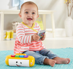 Fisher-Price Laugh & Learn speaker with green button introduces numbers and counting