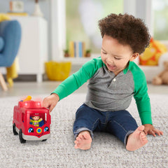 Fisher-Price Little People fire truck driver-seat figure press activates sounds.