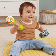 Fisher-Price maracas with colorful beads create engaging rattle sounds for baby play.