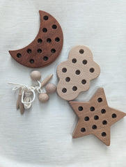 FlameFlash Stars wooden lacing toy boosts concentration during play.