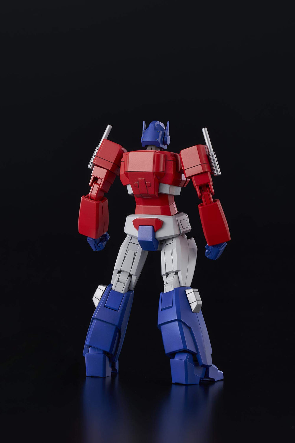 Flame Toys Optimus Prime blaster accessory for action-ready display.