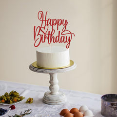 Florcmet red glitter topper seated on cake for a ready-to-display look