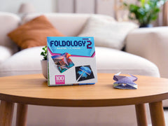 Foldology 2 expansion progressive difficulty grows the challenge over time.