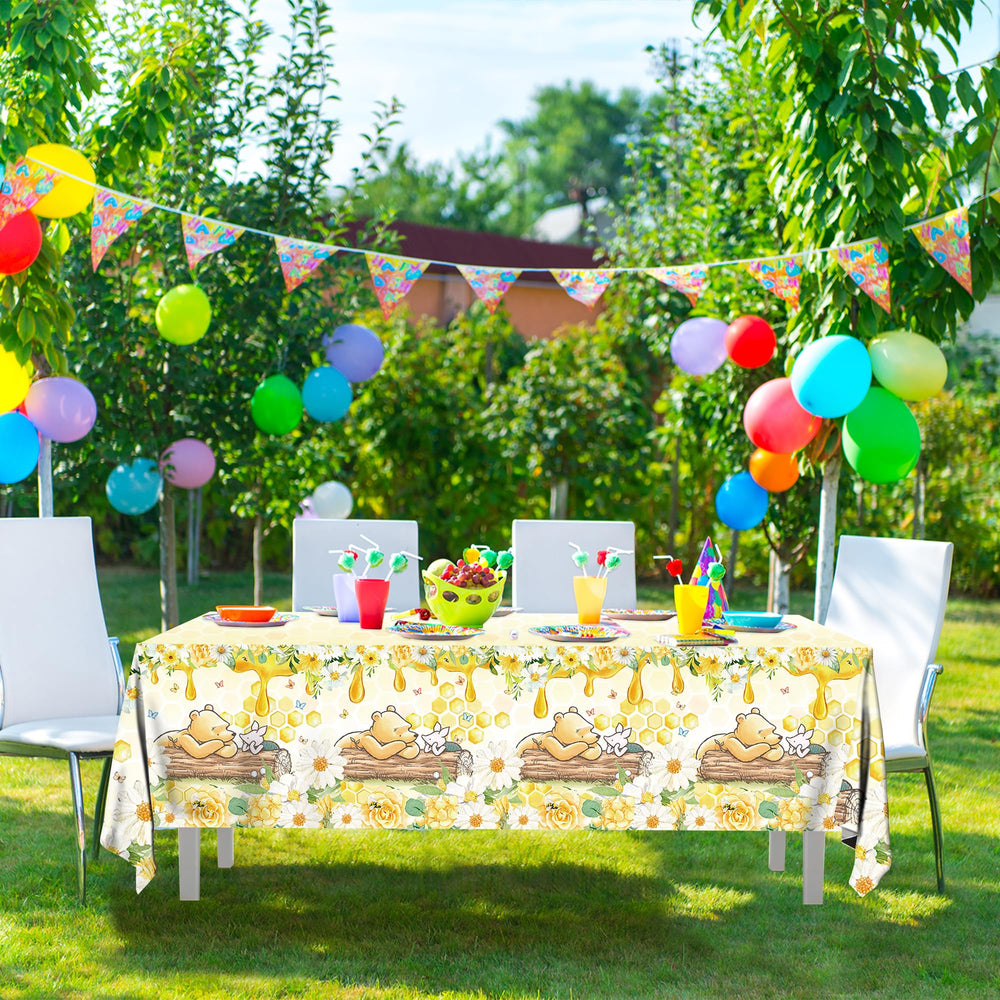 FOLNESH classic Winnie Bear theme table cover enhances kids' birthday decorations.