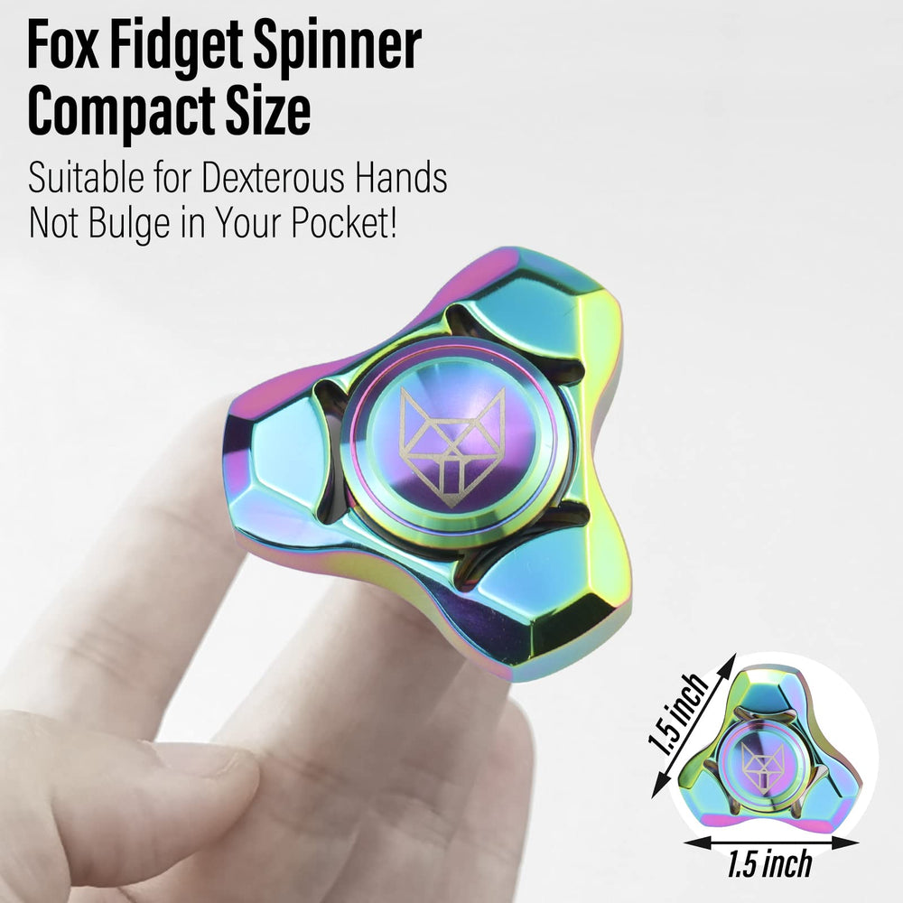 FREELOVE fox-inspired mini-gyro held between fingers for dexterity