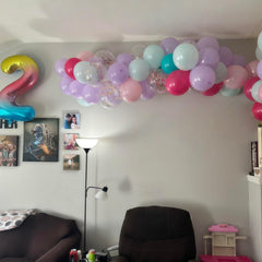 Froova graduation confetti balloons create a bright, celebratory backdrop for photos.