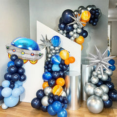 FunHot dark blue 12 inch space balloon anchors bold cosmic backdrop.