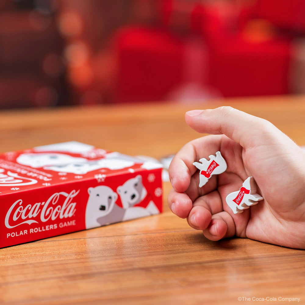 Funko Coca-Cola Polar Rollers packaging opens during cozy holiday gatherings.