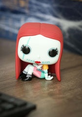 Funko Sally Sewing vinyl figure pose view, perfect for shelf display and collection expansion.