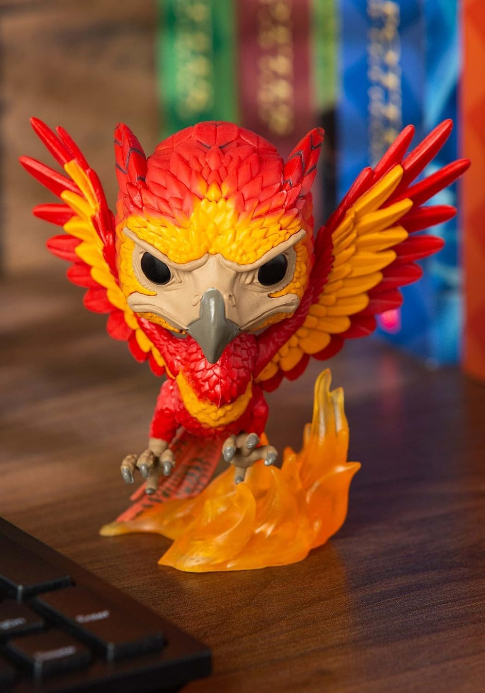 Funko Pop! Harry Potter Fawkes figure on a desk for easy display.