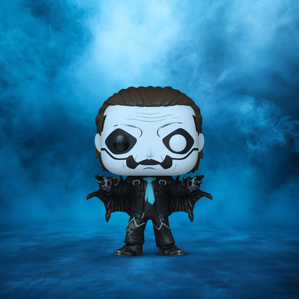 Funko Ghost Papa Emeritus IV figure with glitter finish enhances a desk.