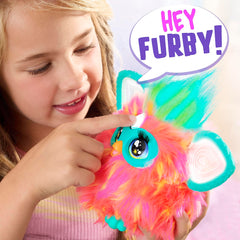 Furby Coral heart gem activates voice commands for interactive play.
