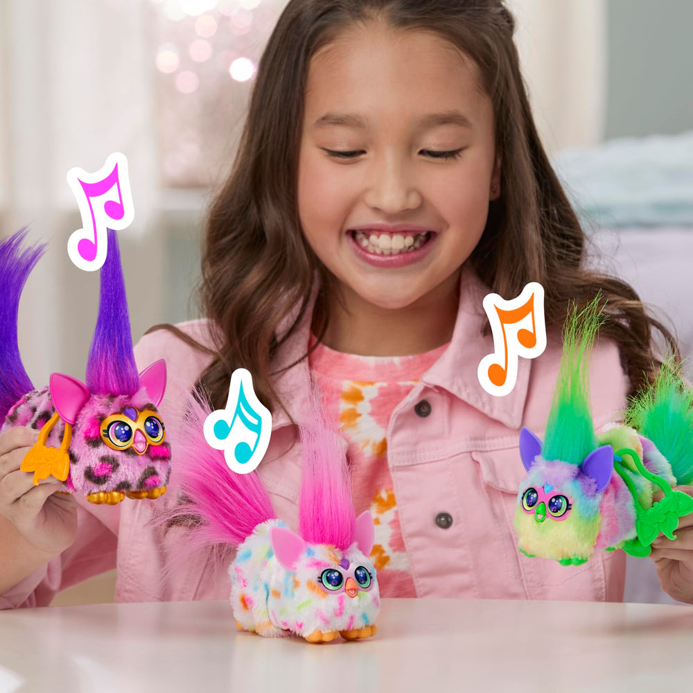 Furby DJ Furblets Kitt-Ee-Luv clip attaches to a bag for portable fun.