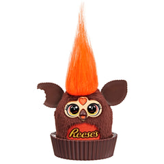 Furby Furblets Reese's cup mini sits in a pretend Reese's cup for display.