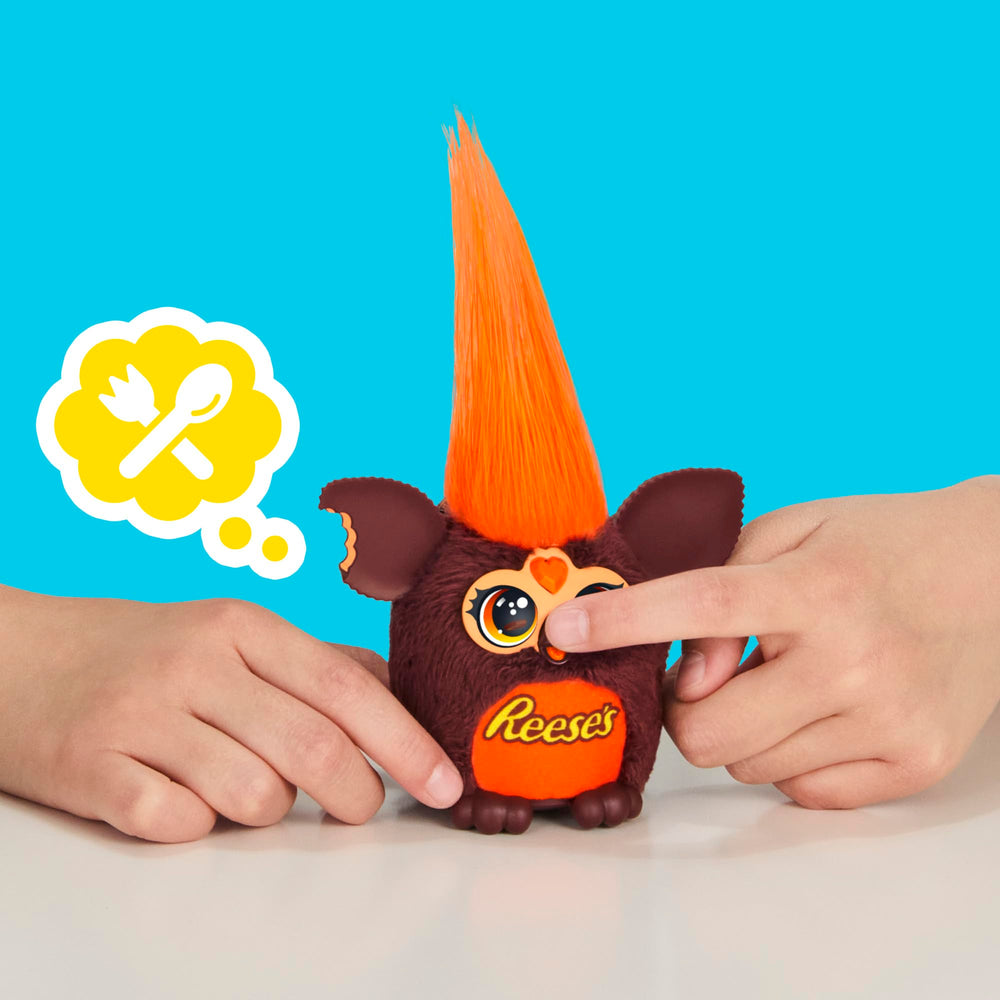Mini plush resting in its pretend Reese's cup toy for display.