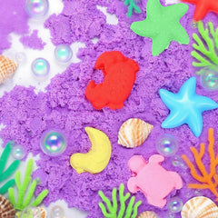 Child kneading FURWEY sensory sand, developing fine motor skills with tactile play.