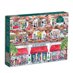 Galison Michael Storrings bookshelf puzzle cover showing inviting colors for cozy evenings