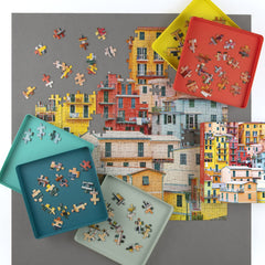 Galison sorting trays stacked neatly, ideal for multi-user puzzle nights.