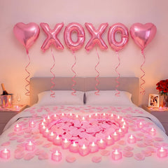 Ganeen pink XOXO letters balloons create a playful romantic centerpiece.