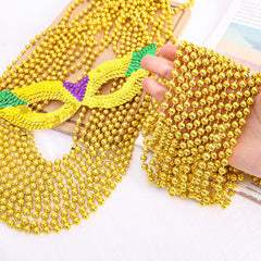 Garma Mardi Gras beads 33-inch necklaces in bright gold for standout outfits.
