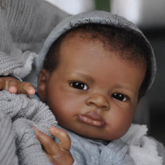 Generic realistic baby doll black boy with detailed hair and textured skin.