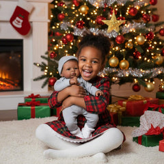 Generic realistic baby doll black boy dressed in outfit ready for dress-up play sessions.